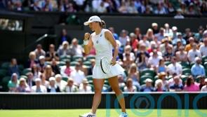 Iga Swiatek extends winning run to 36 matches with first-round Wimbledon success