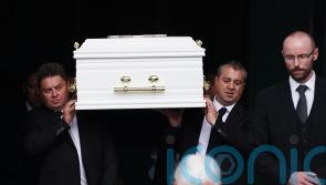 Siblings who died in car fire ‘inseparable in life’, mourners told