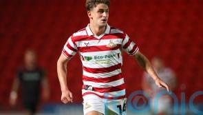 Harrison Biggins and George Miller fire Doncaster to victory over AFC Wimbledon