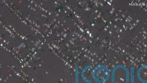 Ukrainian president visits region flooded by breached dam as five confirmed dead