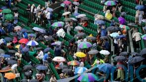 Tennis fans in macs and under umbrellas in queue for Wimbledon’s middle Sunday