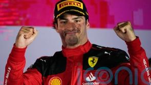 Carlos Sainz holds on for victory in Singapore as Red Bull’s winning run ends