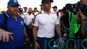Rory McIlroy restrained by Shane Lowry after Ryder Cup argument with US caddie