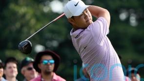 Tom Kim keeps lead as Shane Lowry and Robert MacIntyre shoot into contention