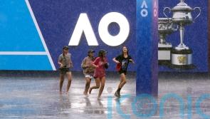 Zheng Qinwen battles to second round as storms lash Melbourne Park