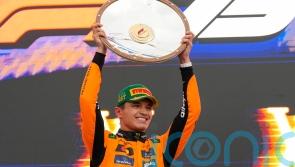 Lando Norris holds off Max Verstappen to win wet Australian Grand Prix