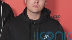 Star of rap group Kneecap charged with terrorism offence over Hezbollah flag