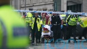 Man detained after car collides with pedestrians during Liverpool title parade