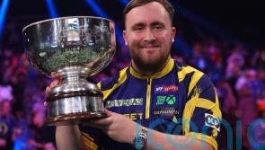Luke Littler celebrates world number one status by retaining Grand Slam of Darts