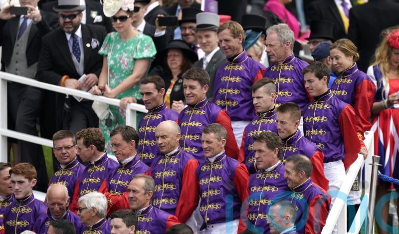Spectacular sight at Epsom as Queen’s jockeys form guard of honour