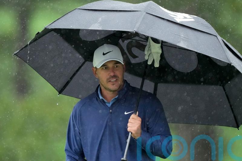 Masters suspended after heavy rain with Brooks Koepka leading the way at Augusta