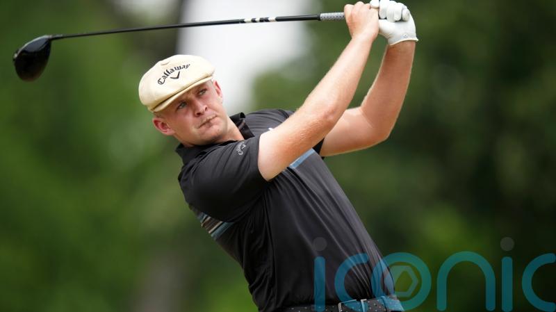 Harry Hall bounces back from double blow to keep share of lead