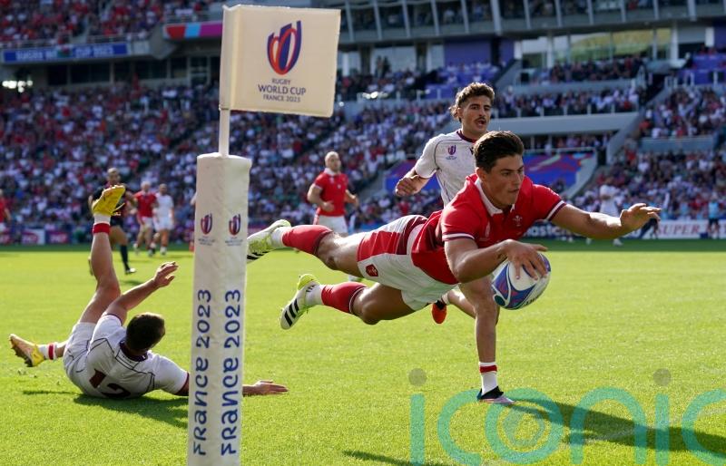 Louis Rees-Zammit claims hat-trick of tries as Wales comfortably top group