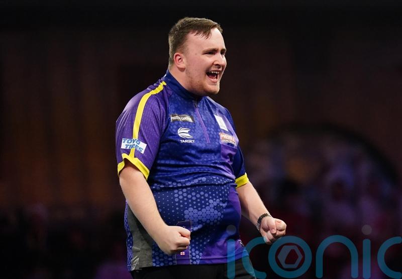 Luke Littler continues dream World Championship with victory over Andrew Gilding