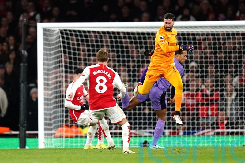 Arsenal capitalise on Alisson Becker errors to cut Liverpool lead to two points