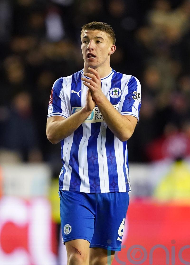 Lincoln’s impressive unbeaten run ended as Wigan snatch last-gasp victory