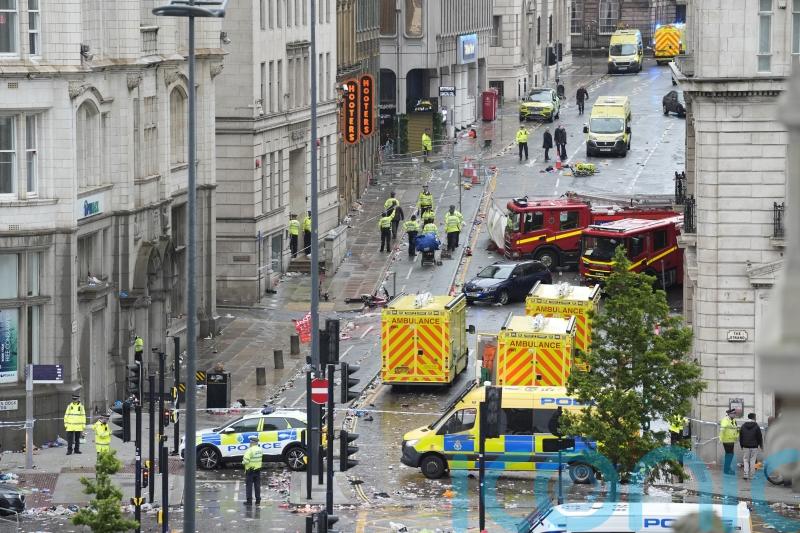 Four children among injured after car ploughs into Liverpool parade crowd