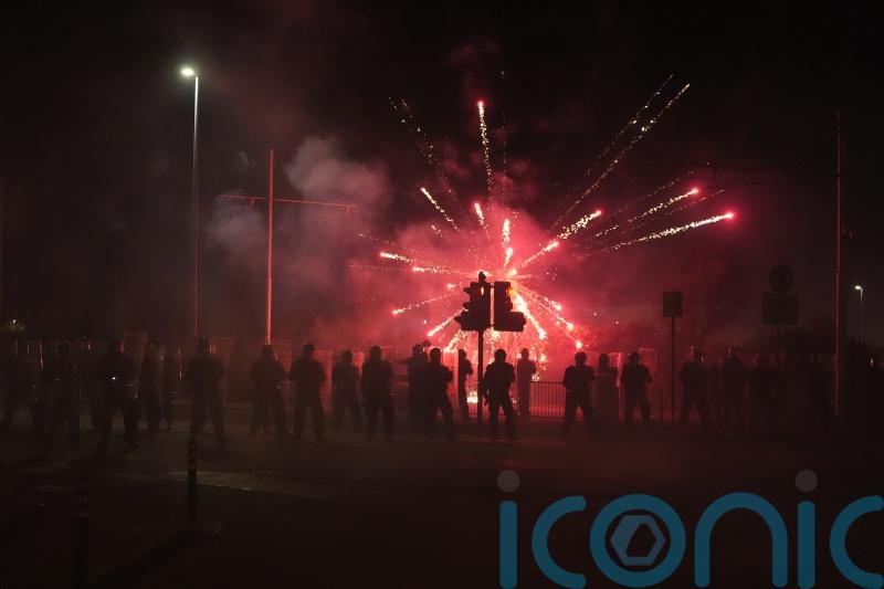 Fireworks and stones thrown at police for second night at asylum seeker hotel