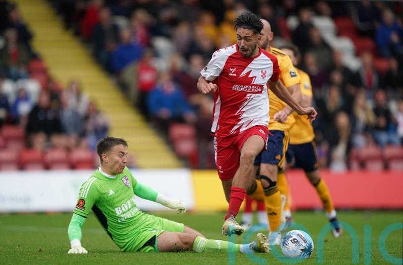 Rochdale stay at the summit despite goalless draw at Woking