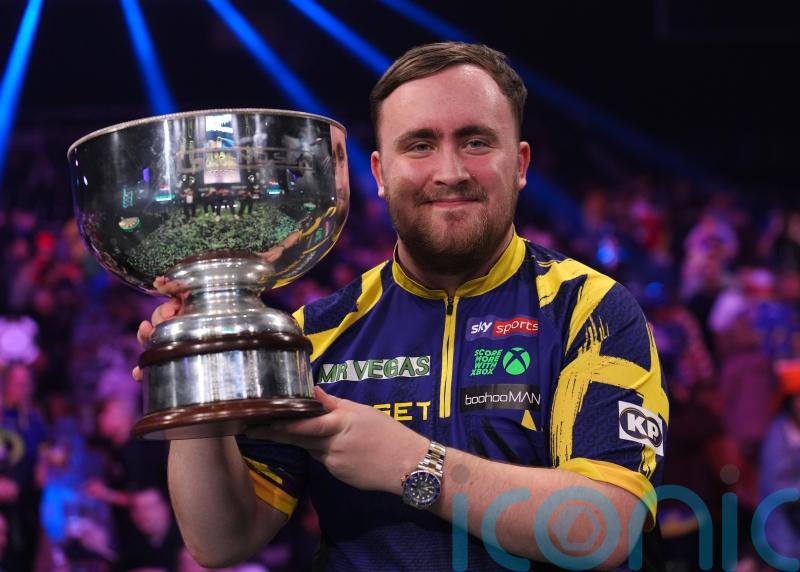 Luke Littler celebrates world number one status by retaining Grand Slam of Darts