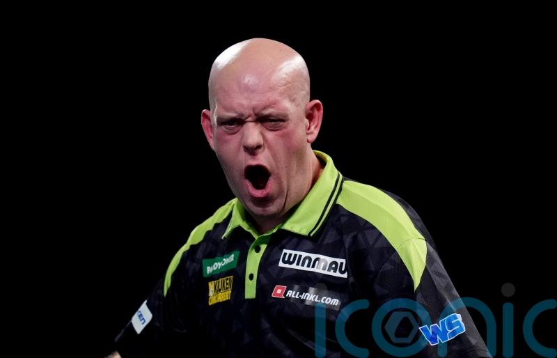 Michael van Gerwen survives scare to reach World Championship second round