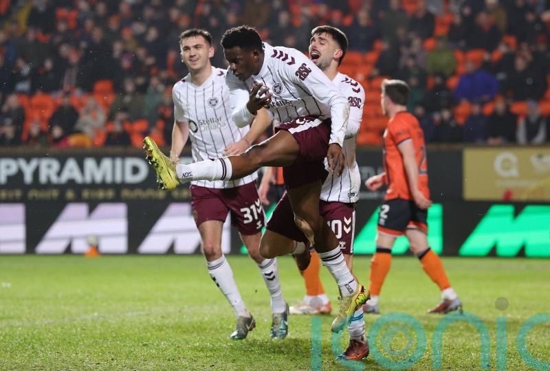 Hearts surge seven points clear after brushing aside nine-man Dundee United