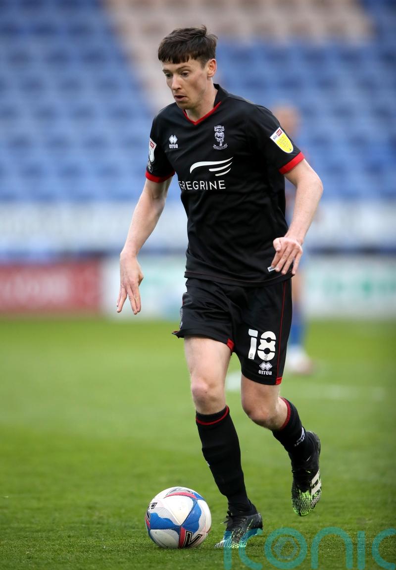 Lincoln stroll past Blackpool to keep promotion charge going