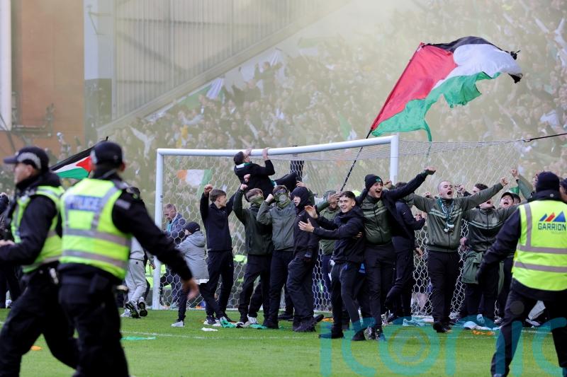 Fans clash on Ibrox pitch after Celtic knock Rangers out of cup on penalties